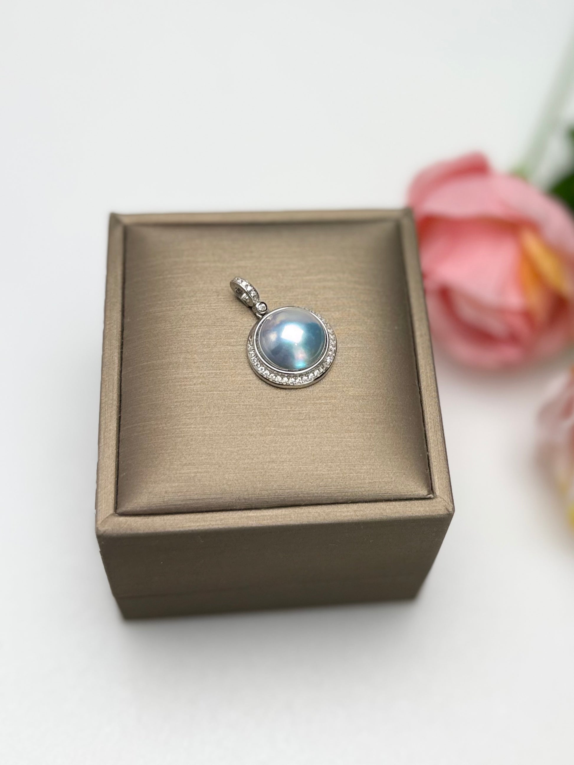Silvery-Blue Saltwater Mabe Pearl Pendant with Iridescent Overtones.