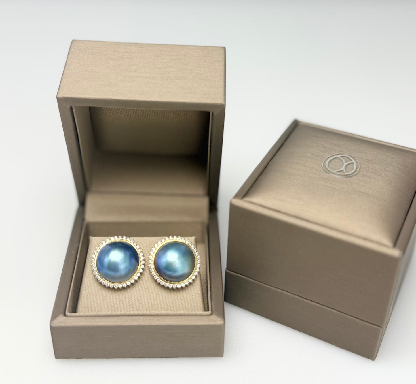 Elegant Saltwater Mabe Pearl (15mm) Earrings with CZ.