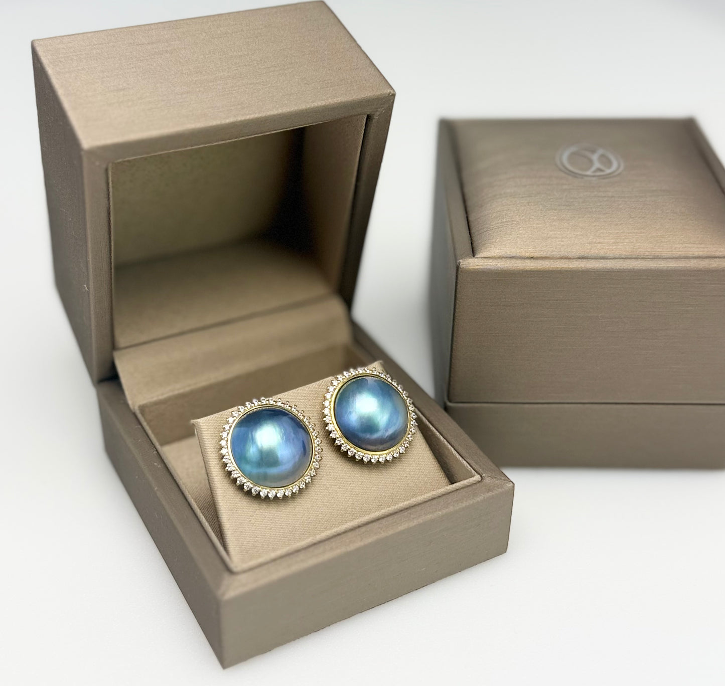 Elegant Saltwater Mabe Pearl (15mm) Earrings with CZ.